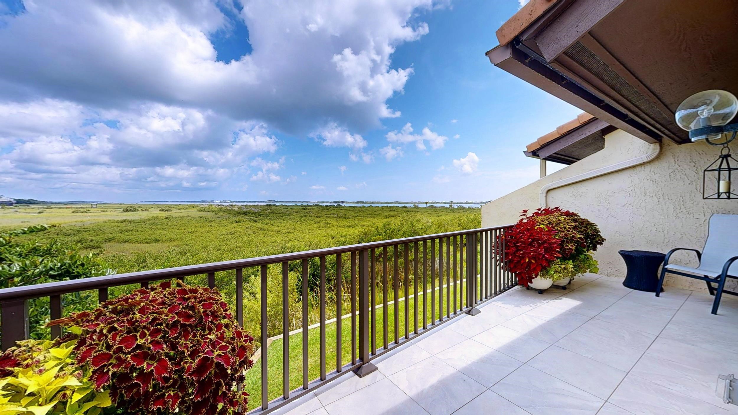 3431 Harbor Drive St. Augustine, FL 32084 - Photo 4 of 61 a view of a chairs and table in the balcony