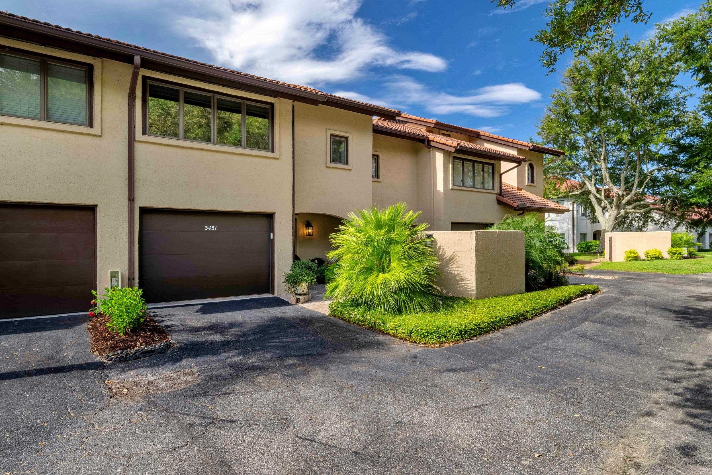 3431 Harbor Drive St. Augustine, FL 32084 - Photo 5 of 61 a front view of a house with a yard and garage