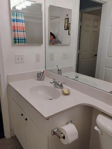 a bathroom with a sink and a mirror