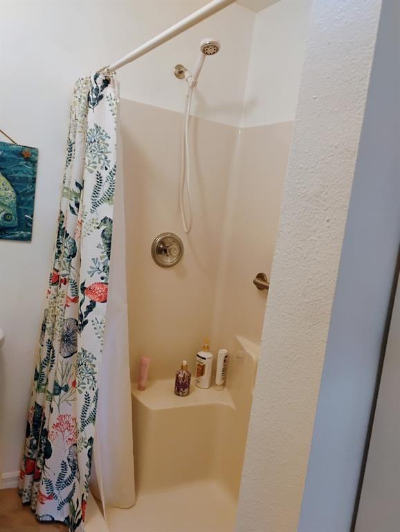 14441 Dulce Real Avenue Fort Pierce, FL 34951 - Photo 19 of 23 a bathroom with a bathtub and shower