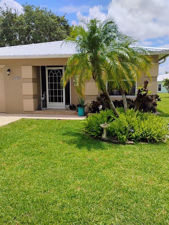 14441 Dulce Real Avenue Fort Pierce, FL 34951 - Photo 2 of 23 a view of a back yard of the house