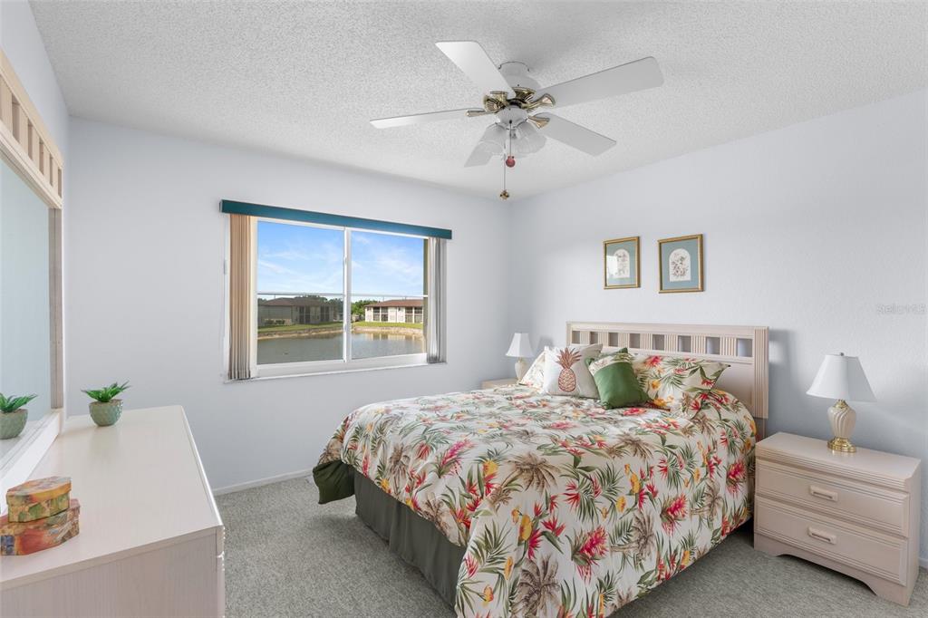 25100 Sandhill Boulevard, Unit R202 Punta Gorda, FL 33983 - Photo 14 of 39 a bedroom with a bed and a window