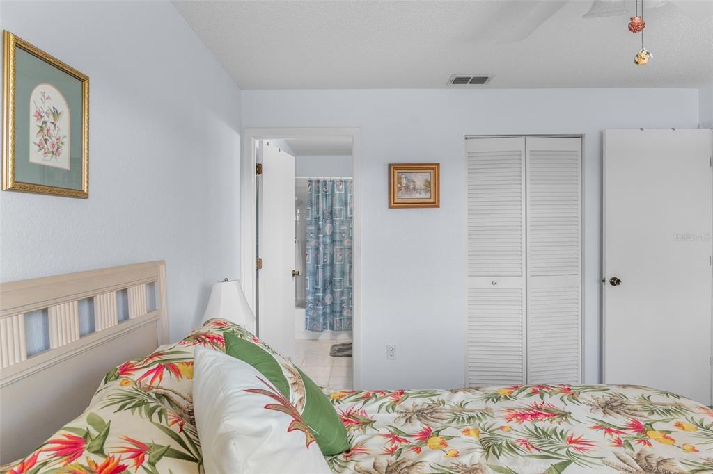 25100 Sandhill Boulevard, Unit R202 Punta Gorda, FL 33983 - Photo 17 of 39 a bedroom with bed and a window