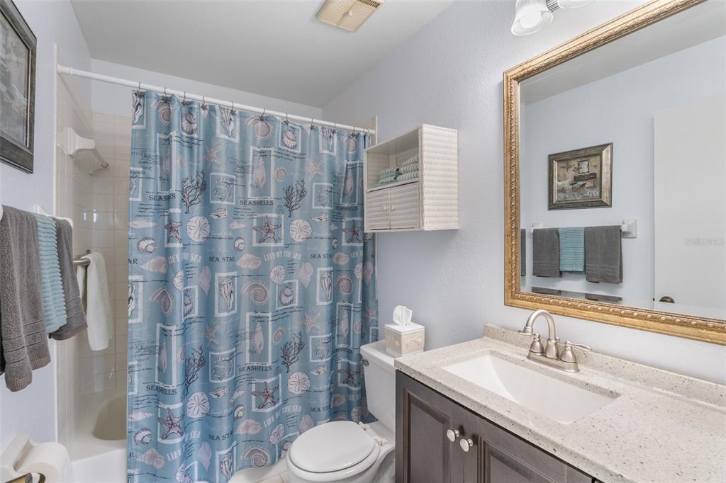 25100 Sandhill Boulevard, Unit R202 Punta Gorda, FL 33983 - Photo 18 of 39 a bathroom with a sink toilet and shower
