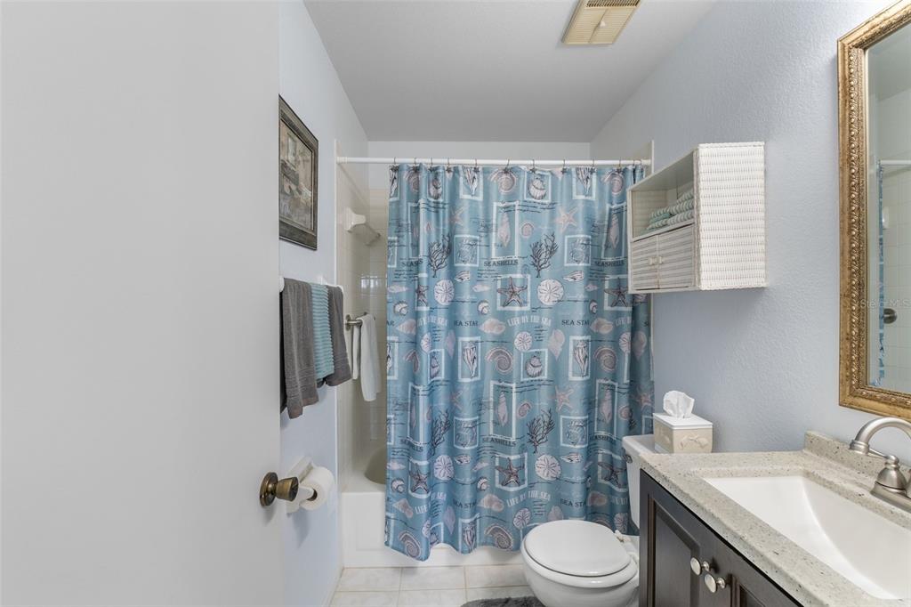 25100 Sandhill Boulevard, Unit R202 Punta Gorda, FL 33983 - Photo 19 of 39 a bathroom with a sink toilet and shower