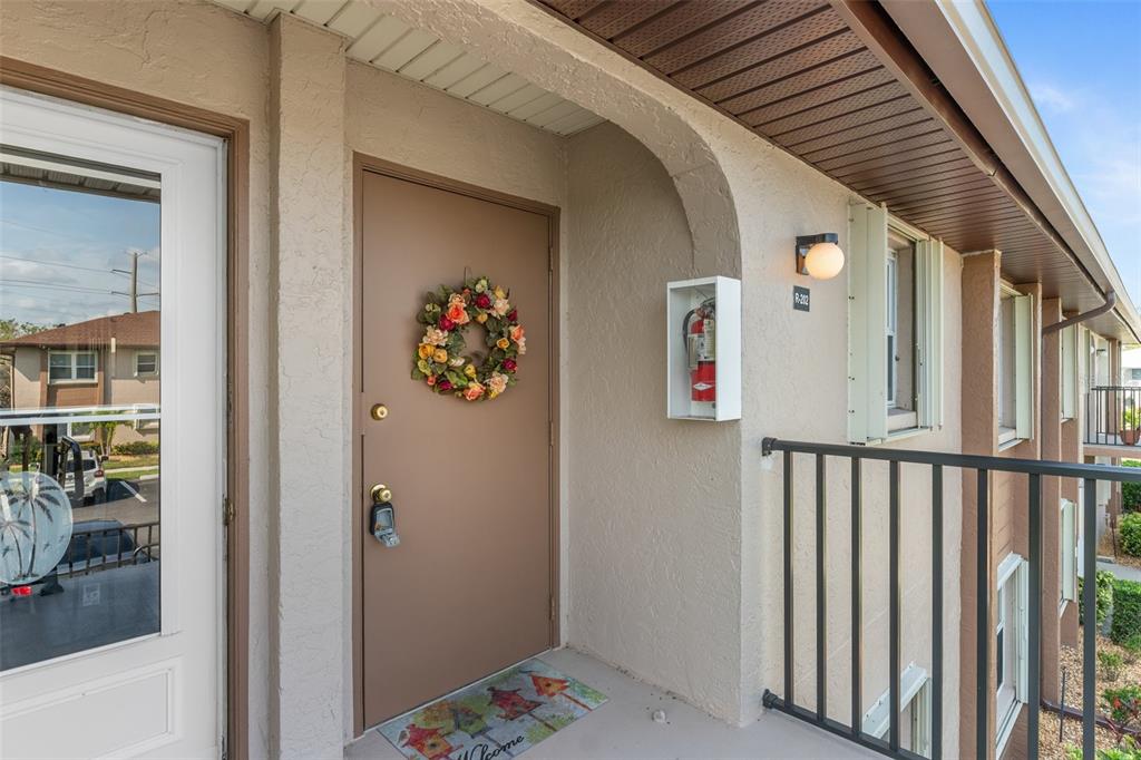 25100 Sandhill Boulevard, Unit R202 Punta Gorda, FL 33983 - Photo 2 of 39 a view of a hallway with a elevator