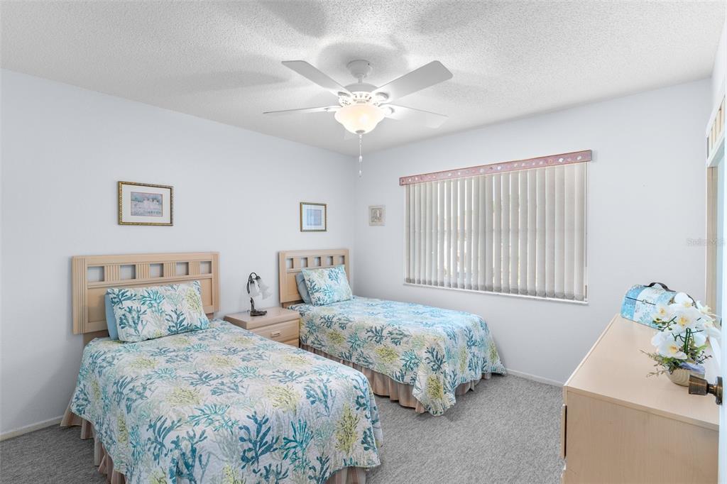 25100 Sandhill Boulevard, Unit R202 Punta Gorda, FL 33983 - Photo 21 of 39 a bedroom with two beds and a window