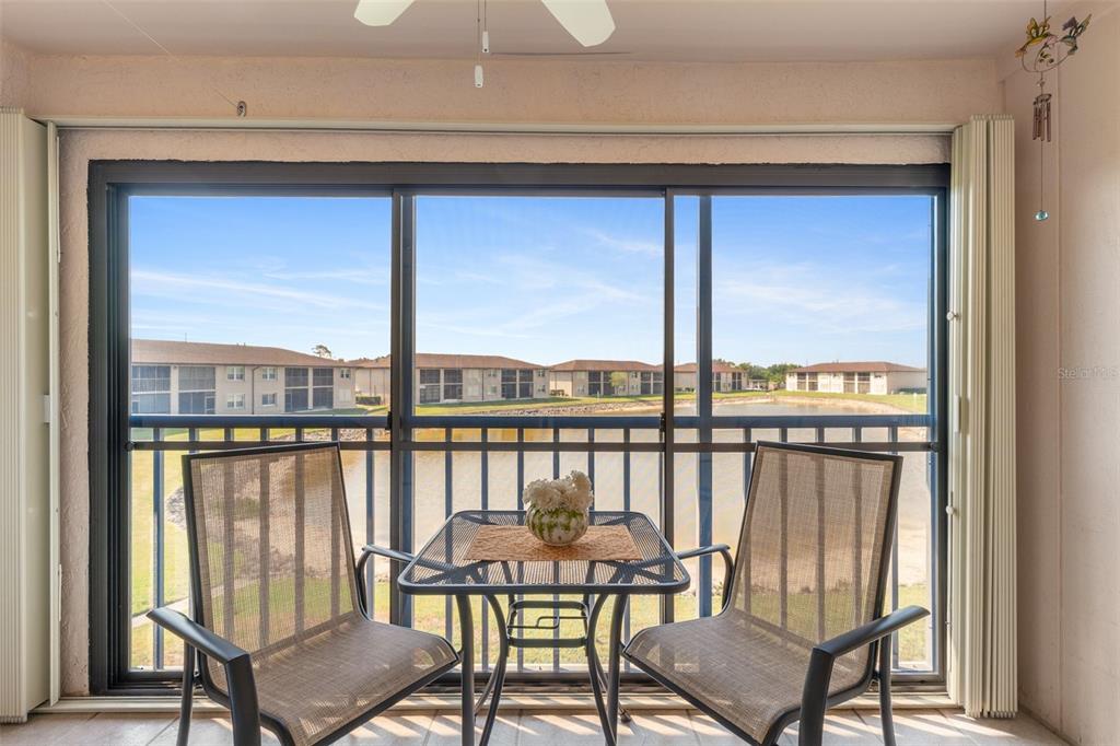 25100 Sandhill Boulevard, Unit R202 Punta Gorda, FL 33983 - Photo 25 of 39 a view of a balcony with chairs