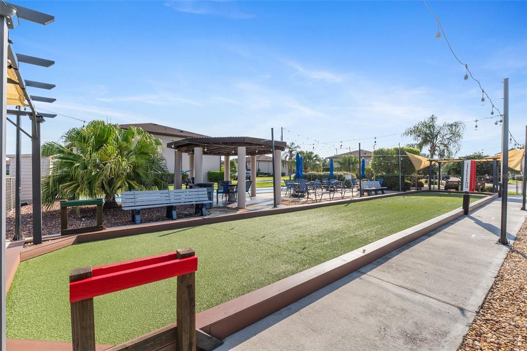 25100 Sandhill Boulevard, Unit R202 Punta Gorda, FL 33983 - Photo 27 of 39 a view of swimming pool with a lounge chairs