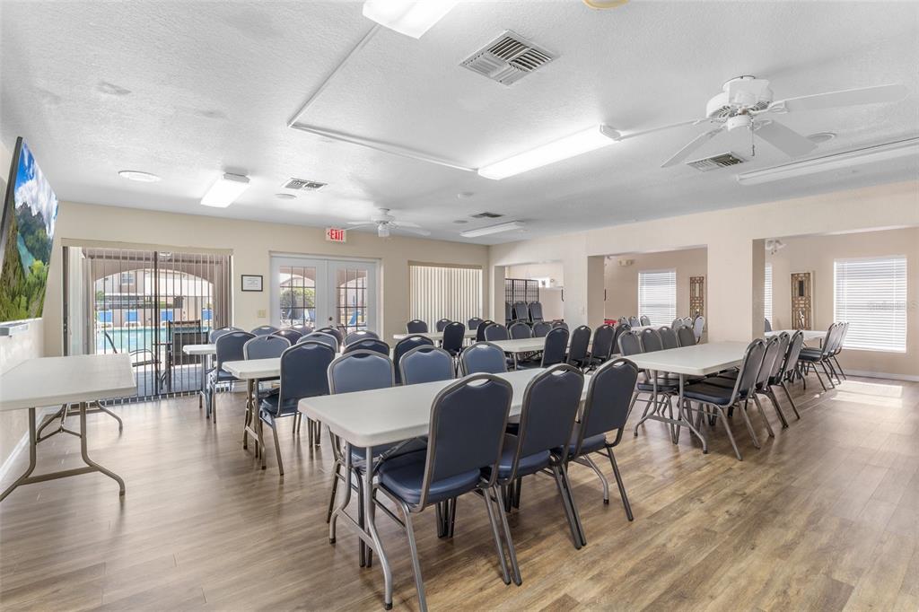 25100 Sandhill Boulevard, Unit R202 Punta Gorda, FL 33983 - Photo 29 of 39 a view of a dining room with furniture window and wooden floor