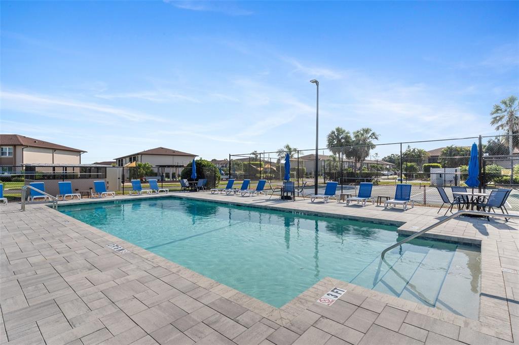 25100 Sandhill Boulevard, Unit R202 Punta Gorda, FL 33983 - Photo 33 of 39 a view of a swimming pool with outdoor seating
