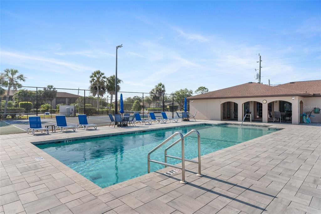 25100 Sandhill Boulevard, Unit R202 Punta Gorda, FL 33983 - Photo 35 of 39 a front view of house with yard and outdoor seating
