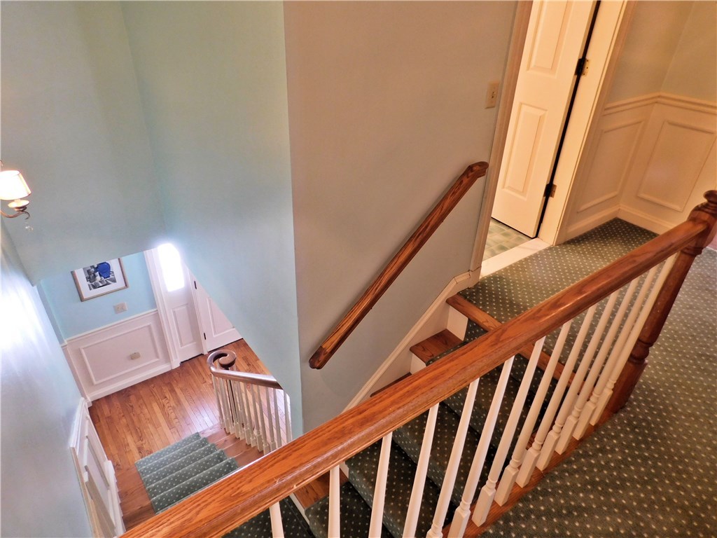 17 Shippee Schoolhouse Road Foster, RI 02825 - Photo 23 of 40 Attractive staircase and upper landing is spacious and comfortable.