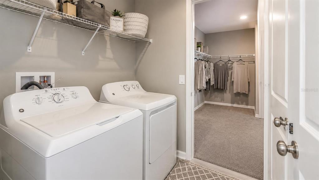 33320 Castaway Loop Wesley Chapel, FL 33543 - Photo 16 of 23 a utility room with dryer and washer