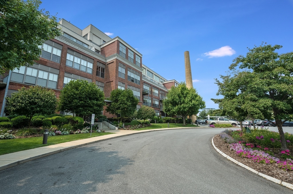 156 Porter Street, Unit 340 Boston, MA 02128 - Photo 5 of 10 a front view of a house with a garden and plants
