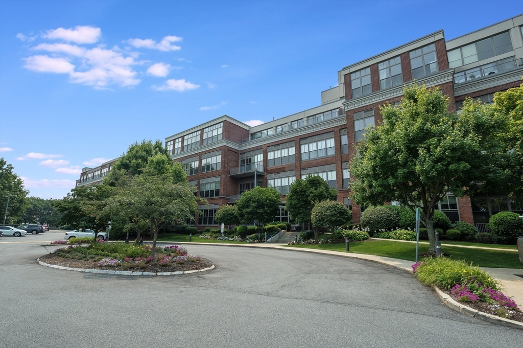 156 Porter Street, Unit 340 Boston, MA 02128 - Photo 6 of 10 a view of a building with a yard