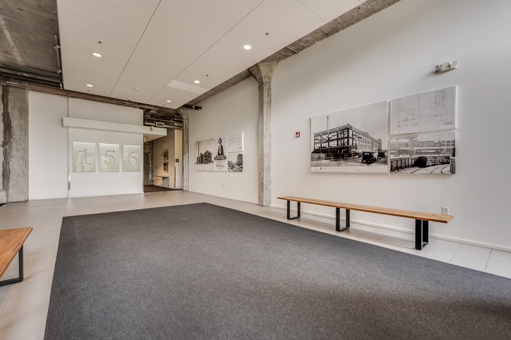 156 Porter Street, Unit 340 Boston, MA 02128 - Photo 7 of 10 a view of a livingroom with furniture and a window