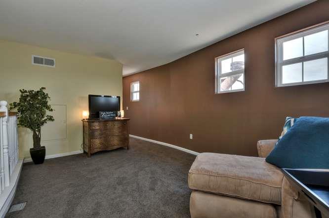 1310 Saddle Rack Street, Unit 438 San Jose, CA 95126 - Photo 11 of 18 a living room with furniture and a flat screen tv