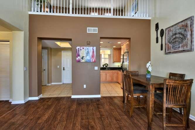 1310 Saddle Rack Street, Unit 438 San Jose, CA 95126 - Photo 6 of 18 a view of a dining room with furniture and wooden floor