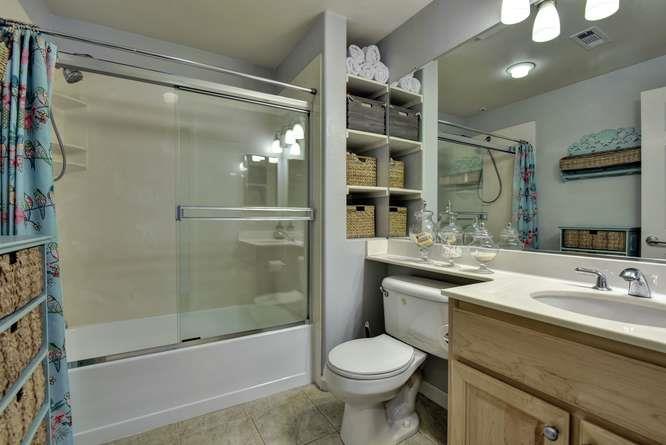 1310 Saddle Rack Street, Unit 438 San Jose, CA 95126 - Photo 9 of 18 a bathroom with a sink toilet and shower