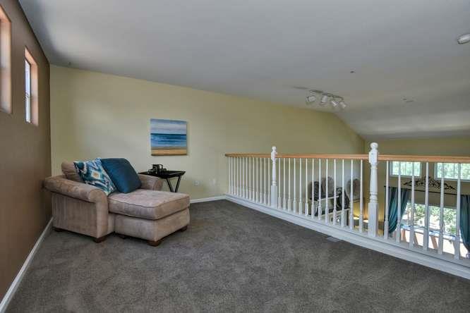 1310 Saddle Rack Street, Unit 438 San Jose, CA 95126 - Photo 10 of 18 a living room with furniture and a large window