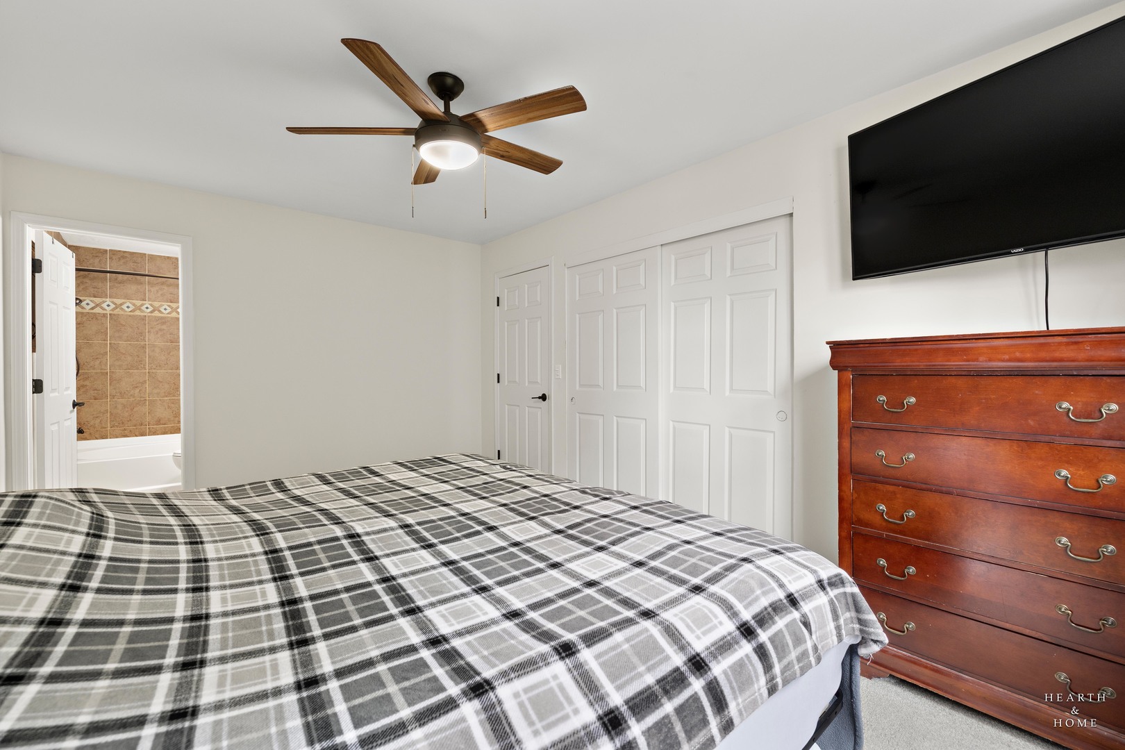 831 Chestnut Court Marengo, IL 60152 - Photo 14 of 29 a bedroom with a bed and a flat screen tv