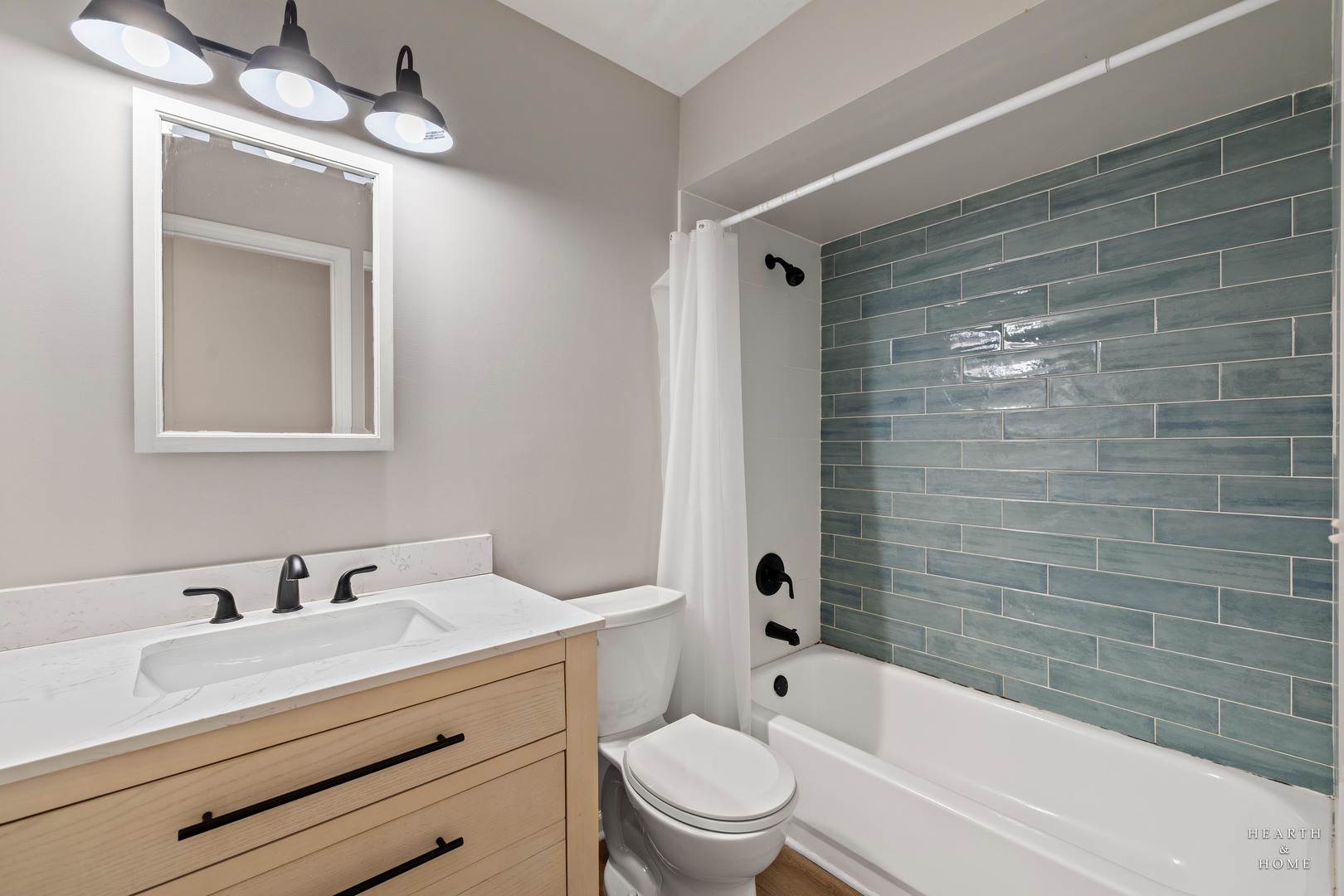 831 Chestnut Court Marengo, IL 60152 - Photo 18 of 29 a bathroom with a bathtub shower sink vanity mirror and toilet