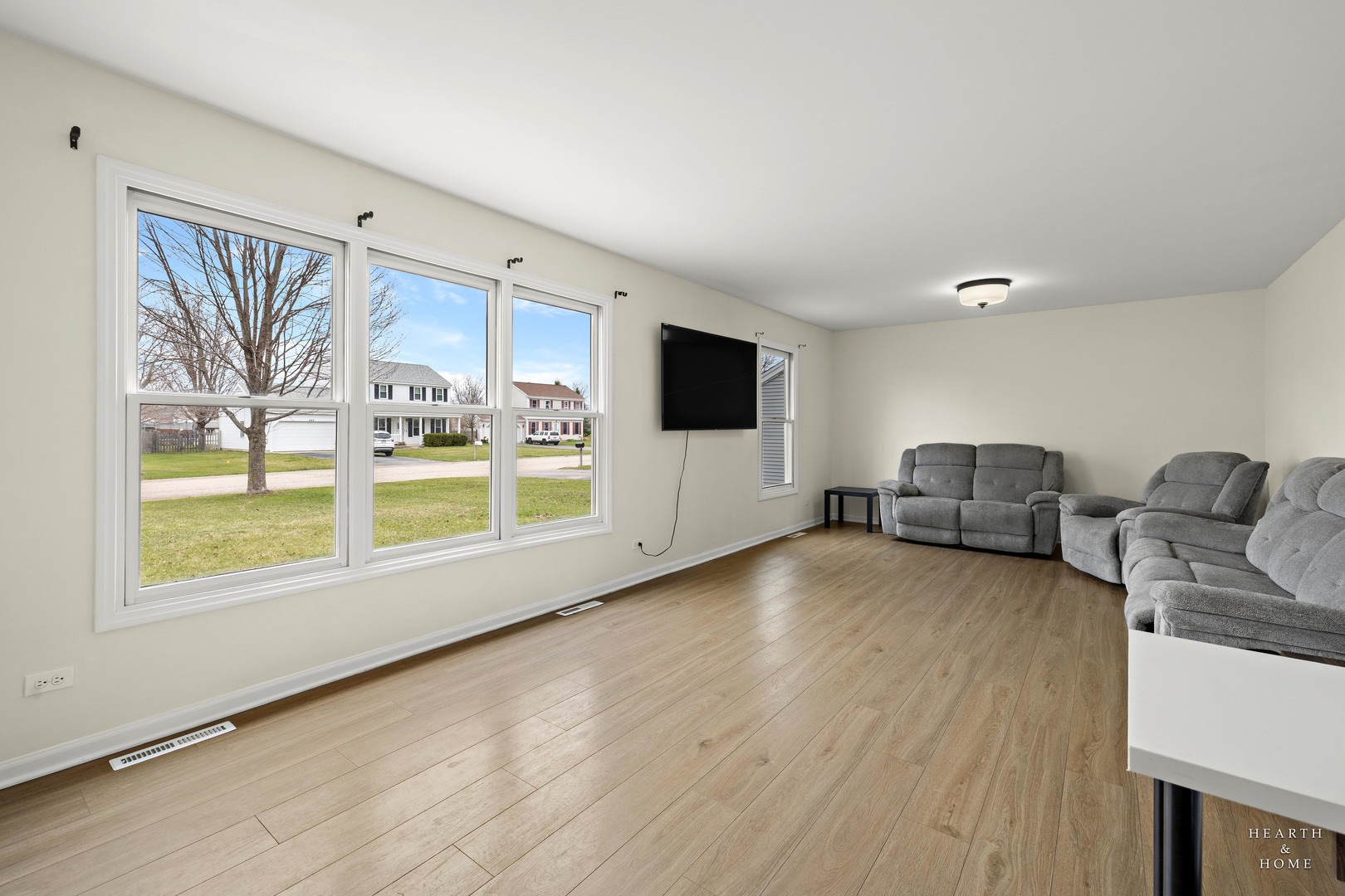831 Chestnut Court Marengo, IL 60152 - Photo 2 of 29 a living room with furniture and a flat screen tv
