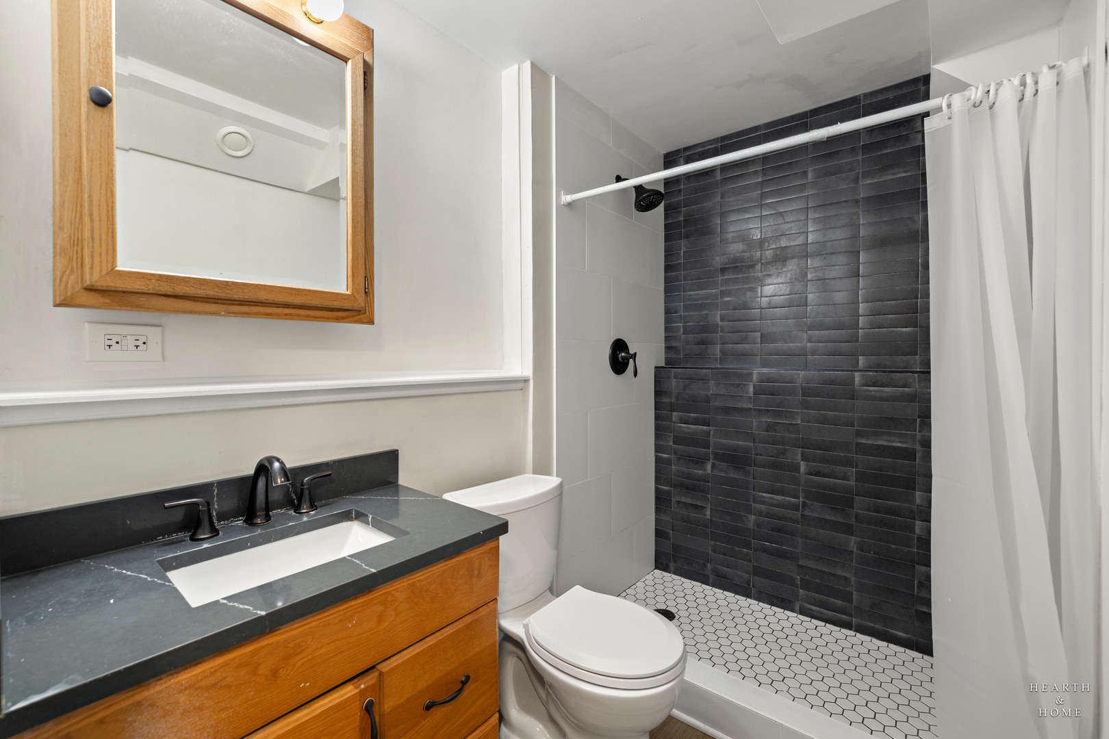 831 Chestnut Court Marengo, IL 60152 - Photo 22 of 29 a bathroom with a sink a toilet and shower