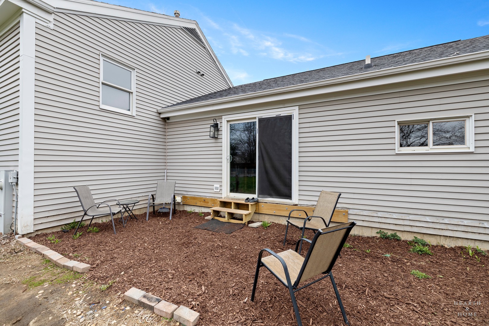 831 Chestnut Court Marengo, IL 60152 - Photo 23 of 29 a backyard of a house with seating space