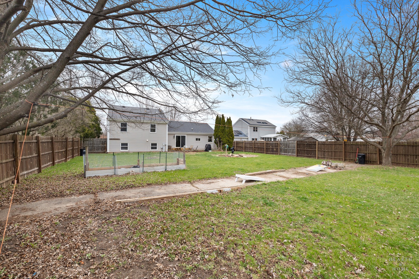 831 Chestnut Court Marengo, IL 60152 - Photo 24 of 29 a view of a house with a yard and a large tree