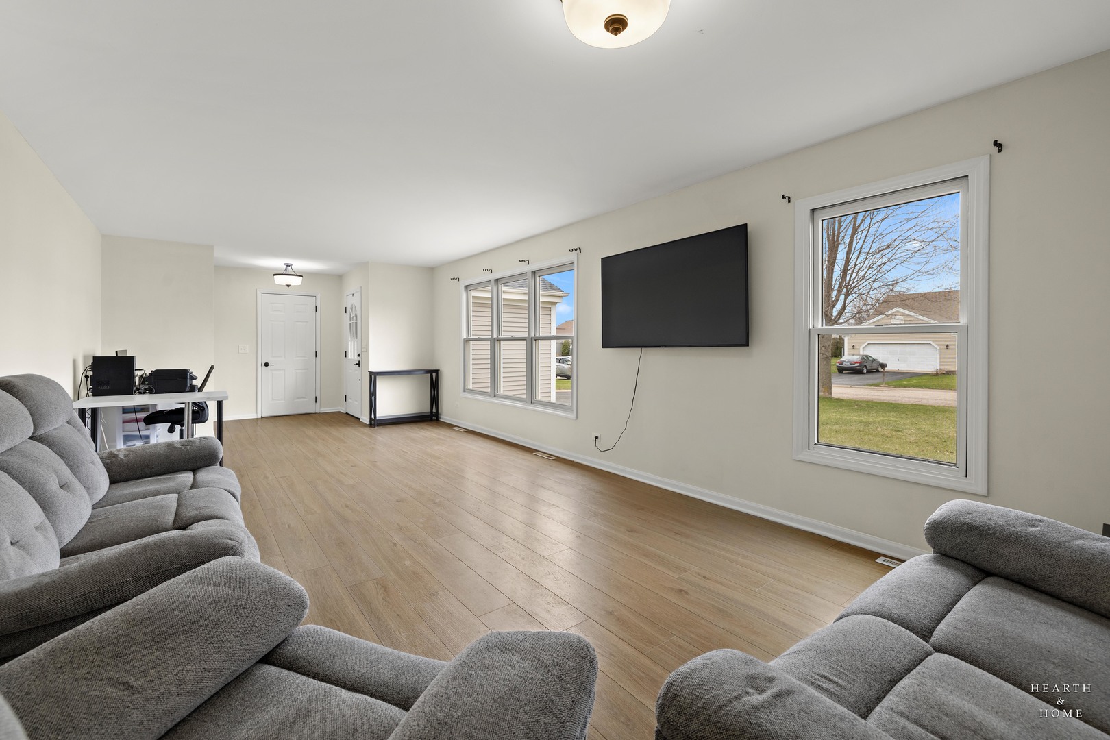 831 Chestnut Court Marengo, IL 60152 - Photo 3 of 29 a living room with furniture and a flat screen tv
