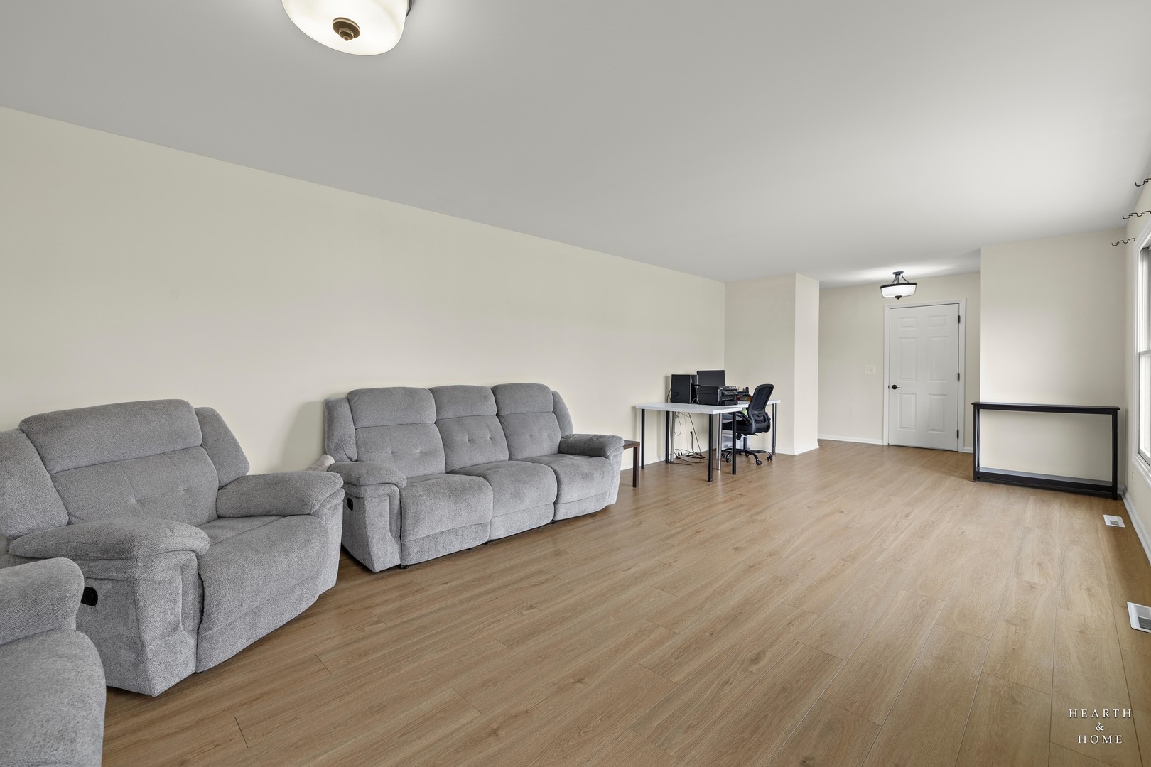 831 Chestnut Court Marengo, IL 60152 - Photo 4 of 29 a living room with furniture and a wooden floor