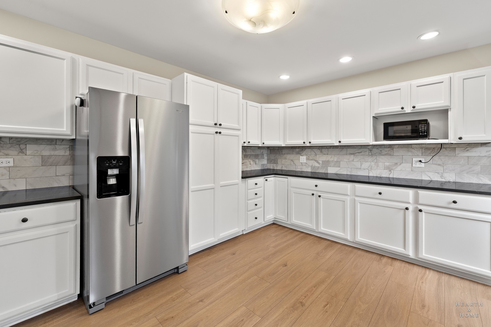 831 Chestnut Court Marengo, IL 60152 - Photo 10 of 29 a kitchen with stainless steel appliances a refrigerator sink and microwave