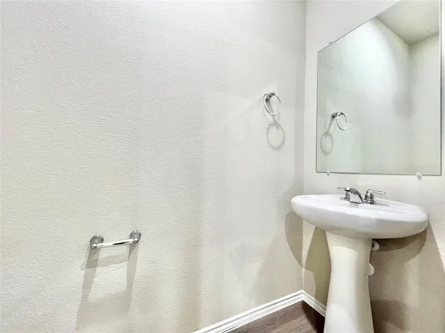 a bathroom with a sink and mirror