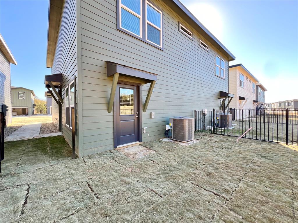 3501 East Renfro Street, Unit 106 Burleson, TX 76028 - Photo 5 of 32 a view of a house with a patio