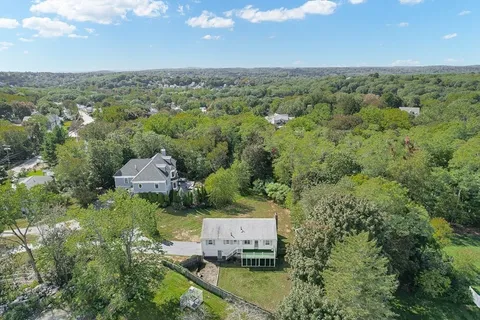 an aerial view of a house with mountain view