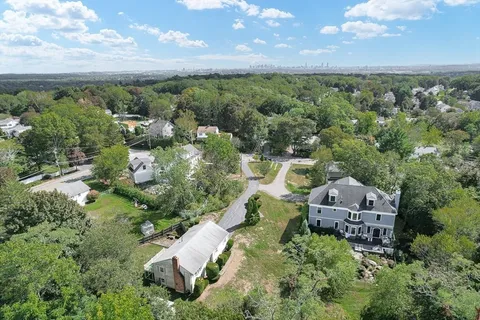 an aerial view of a house with mountain view