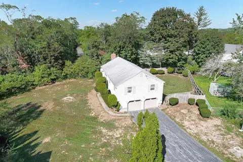 an aerial view of a house with outdoor space
