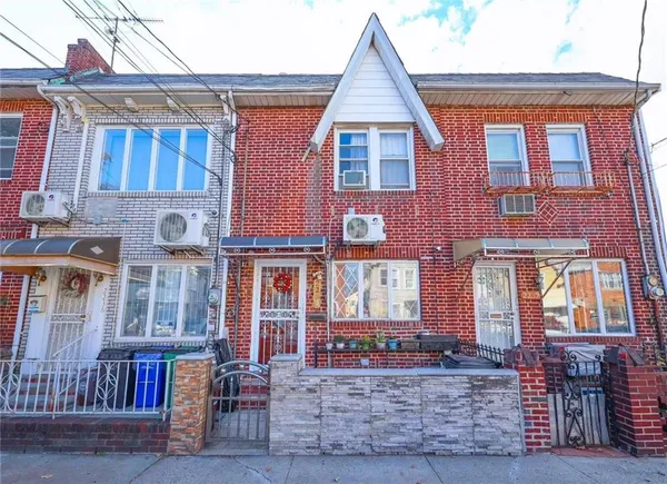 a view of a brick building with many windows