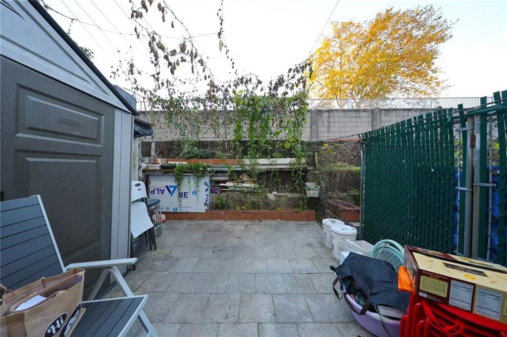 2234 West 7th Street Brooklyn, NY 11223 - Photo 20 of 20 a view of a backyard with sitting area and garden