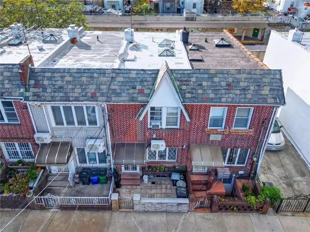 a aerial view of a house with sitting area