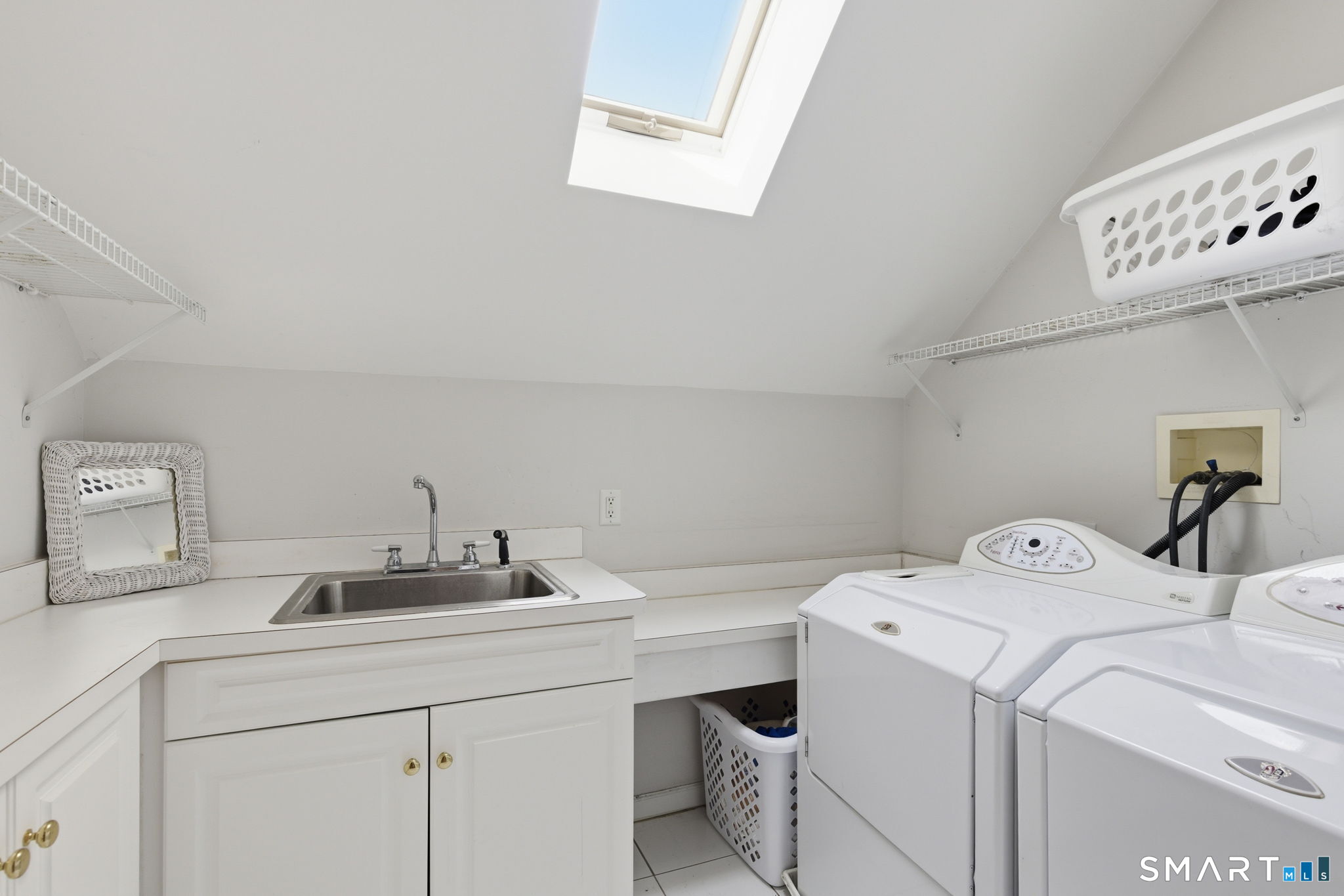 22 Misty Vale Road Newtown, CT 06482 - Photo 17 of 30 a utility room with dryer and washer