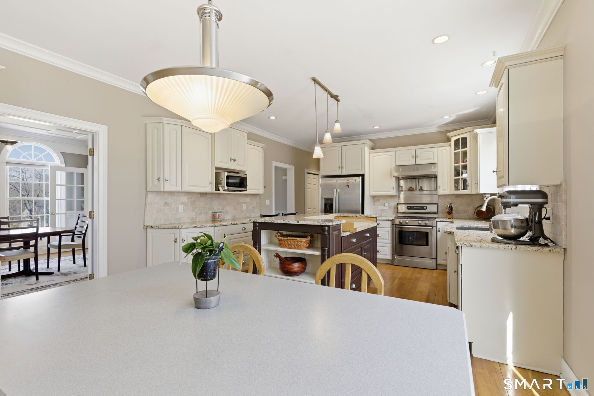 22 Misty Vale Road Newtown, CT 06482 - Photo 2 of 30 a kitchen with furniture a counter top space stainless steel appliances and windows