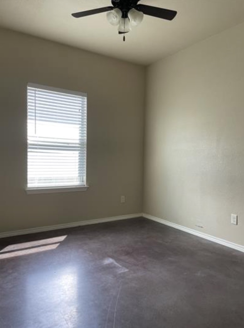 601 Jack Rabbit Lane, Unit B Buda, TX 78610 - Photo 7 of 10 an empty room with a window