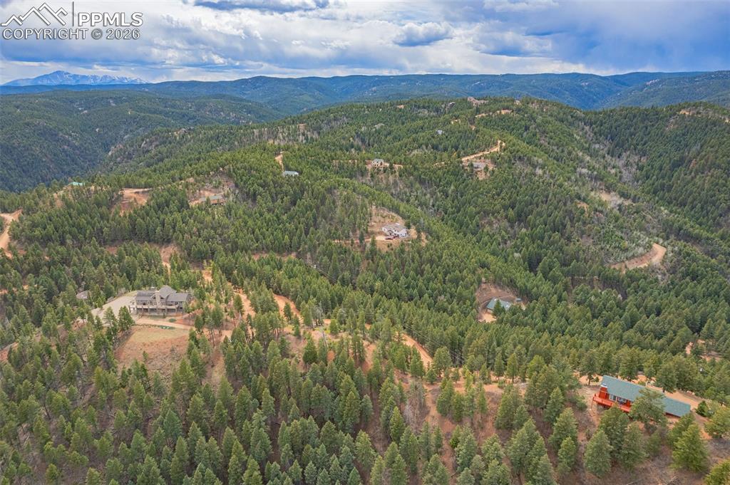 13464 Deer Ridge Way Larkspur, CO 80118 - Photo 5 of 15 a view of a city with mountains in the background