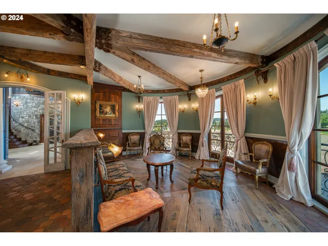 a bedroom with a bed a desk and chair