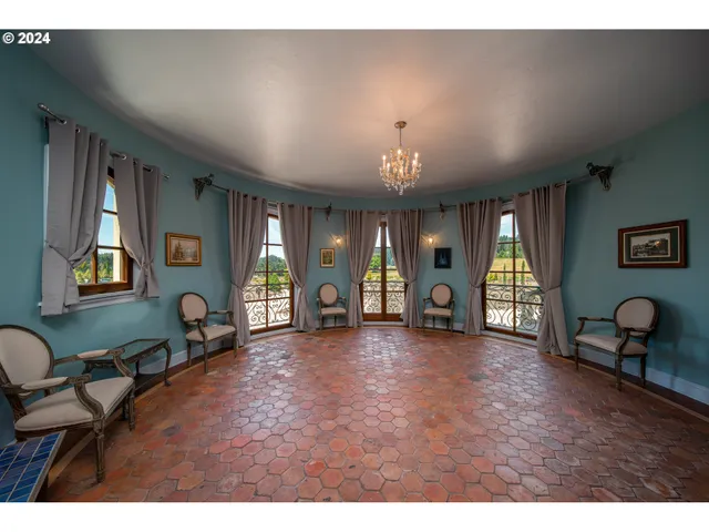 a spacious bathroom with a granite countertop sink mirror and a bathtub