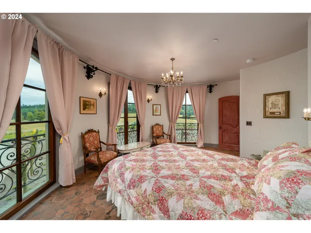 a bathroom with a sink mirror and window