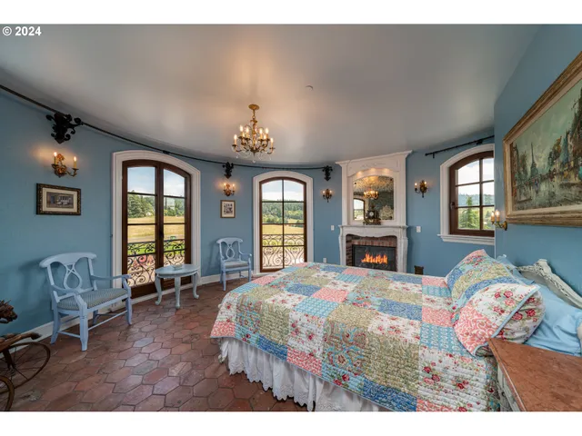 a view of staircase with railing and a chandelier